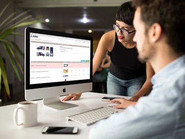Man and woman in office using Aura Brand Solutions online ordering system