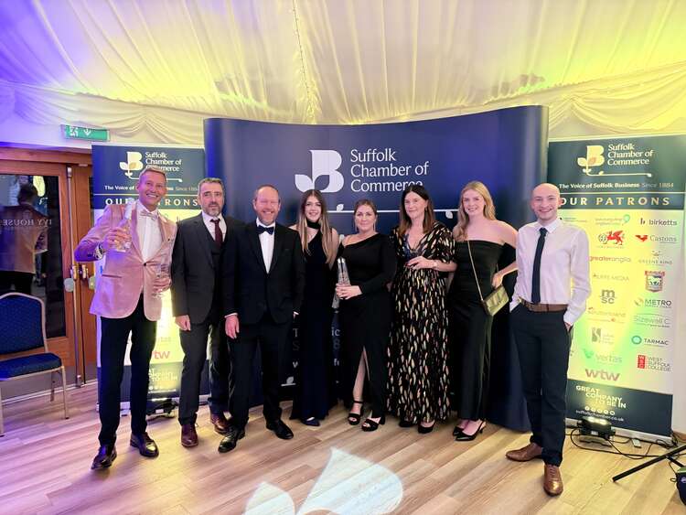 Aura Brand Solutions Team with the Presidents Award and Large Business of the Year