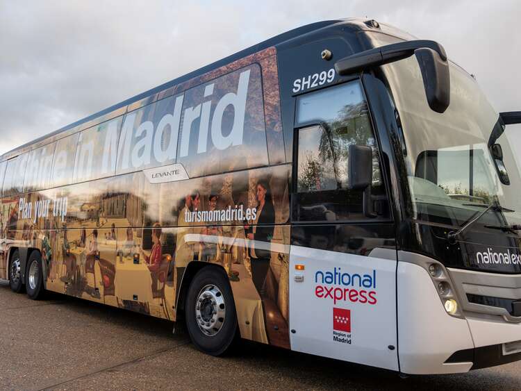 Aura National Express Madrid coach wrap completed outdoor
