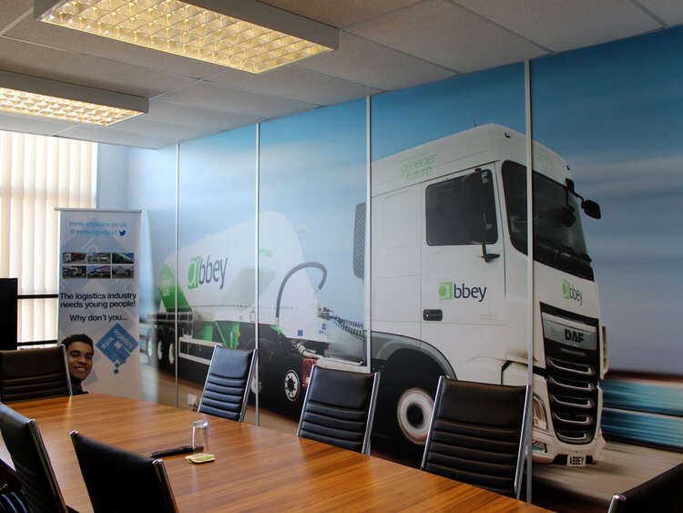 Printed wall wraps and banners brand Abbey Logistics meeting room