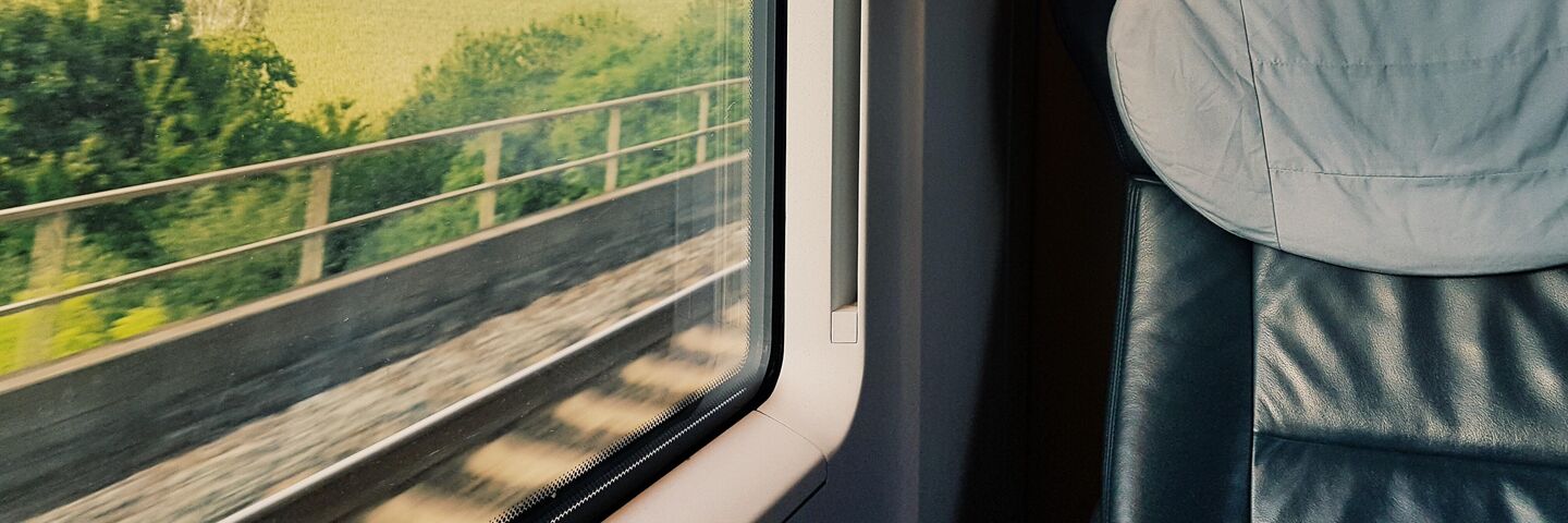 Looking out of a train window with Aura Heat Protect
