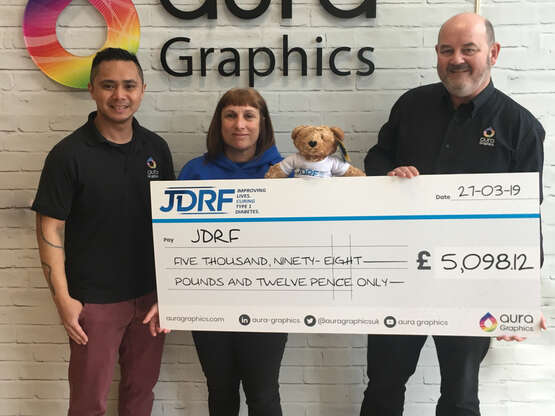 Aura Graphics Give Large Cheque to JDRF