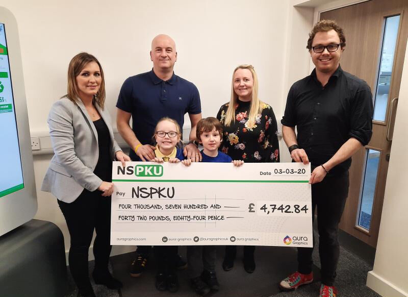 Emma Cranfield (Customer Serivces Director) presenting cheque to NSPKU representative Tom Chimiak