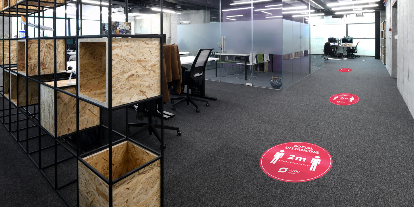 Roundel social distance markers in an office