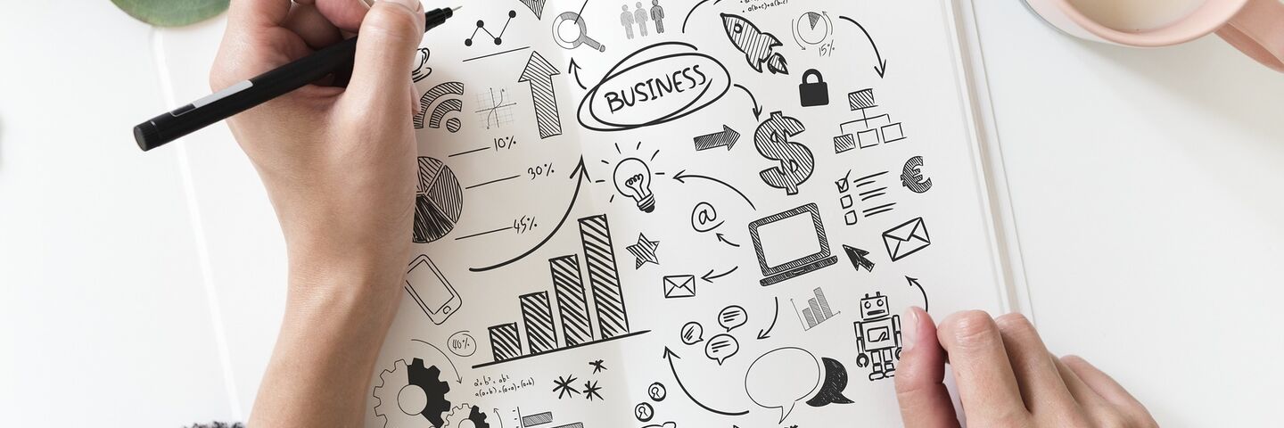 Hand drawing business plan marketing ideas