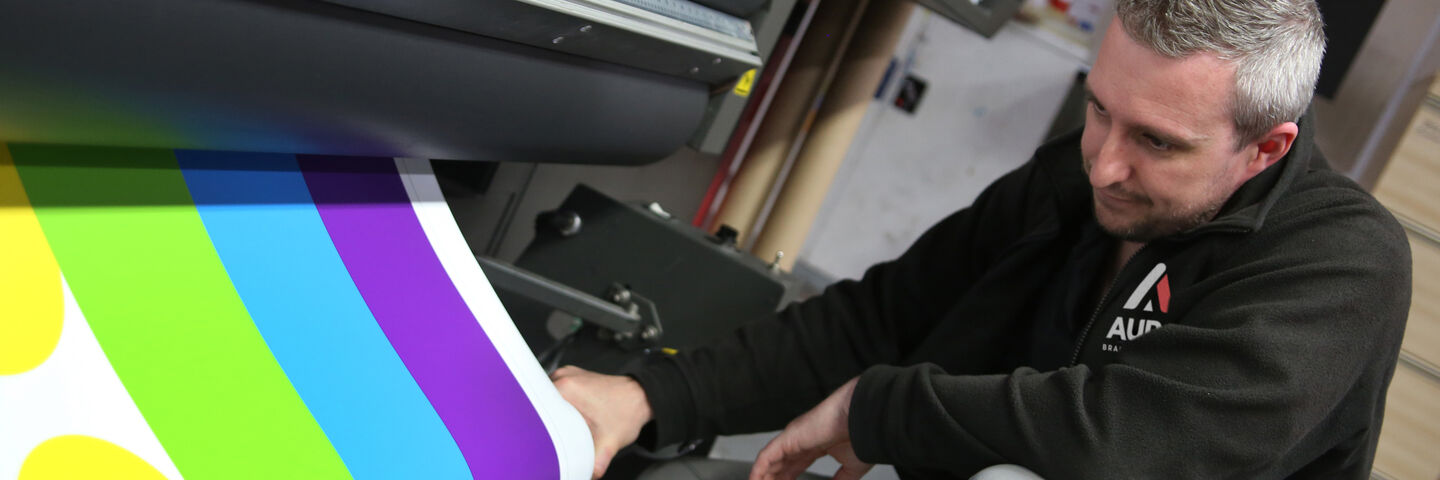 Aura Brand Solution Technician operating printer