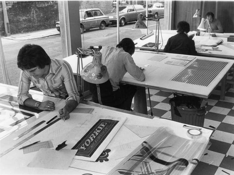 Old school picture of Manufacturing signs manually