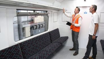 Project manager signing off train carriage interior refurbishment for Greater Anglia train operator