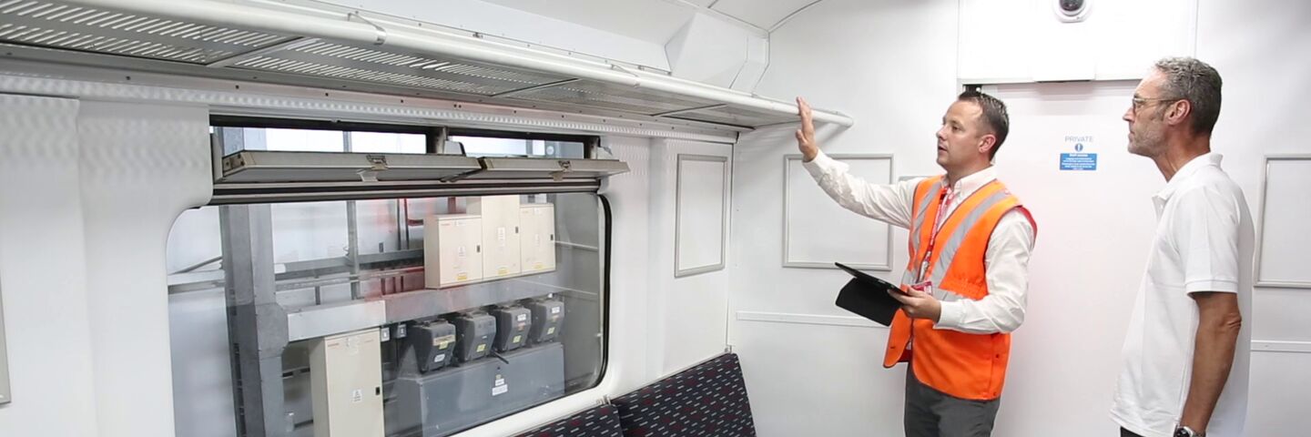 Project manager signing off train carriage interior refurbishment for Greater Anglia train operator