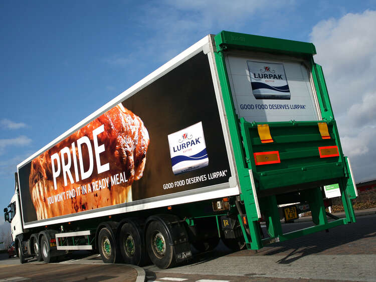 Advertising frame system for changeable promotional livery on Arla trucks