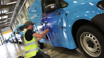 Aura technican installing commercial van graphics for British Gas fleet livery