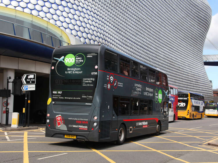 West Midlands bus on the road in fresh livery