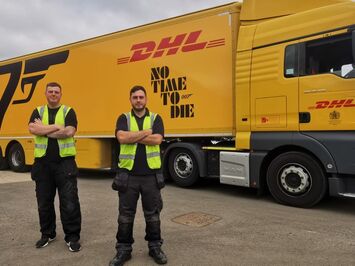 Aura Brand Solutions Installers with freshly wrapped DHL Trailer advertising 2021 James Bond Film