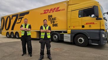 Aura Brand Solutions Installers with freshly wrapped DHL Trailer advertising 2021 James Bond Film