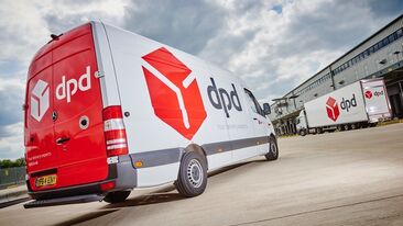 New livery design for DPD fleet applied to delivery vans and trailers at depot