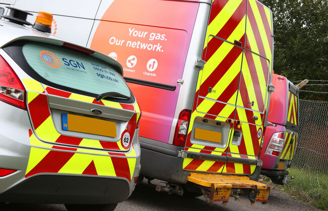 Rear of freshly branded SGN fleet car and van with Chapter 8 hi vis chevrons