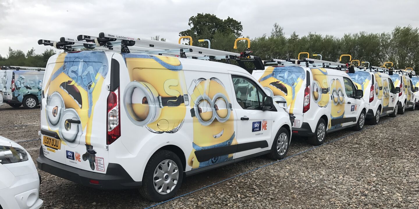 Sky van fleet wrapped in Minions Movie livery for promotional campaign