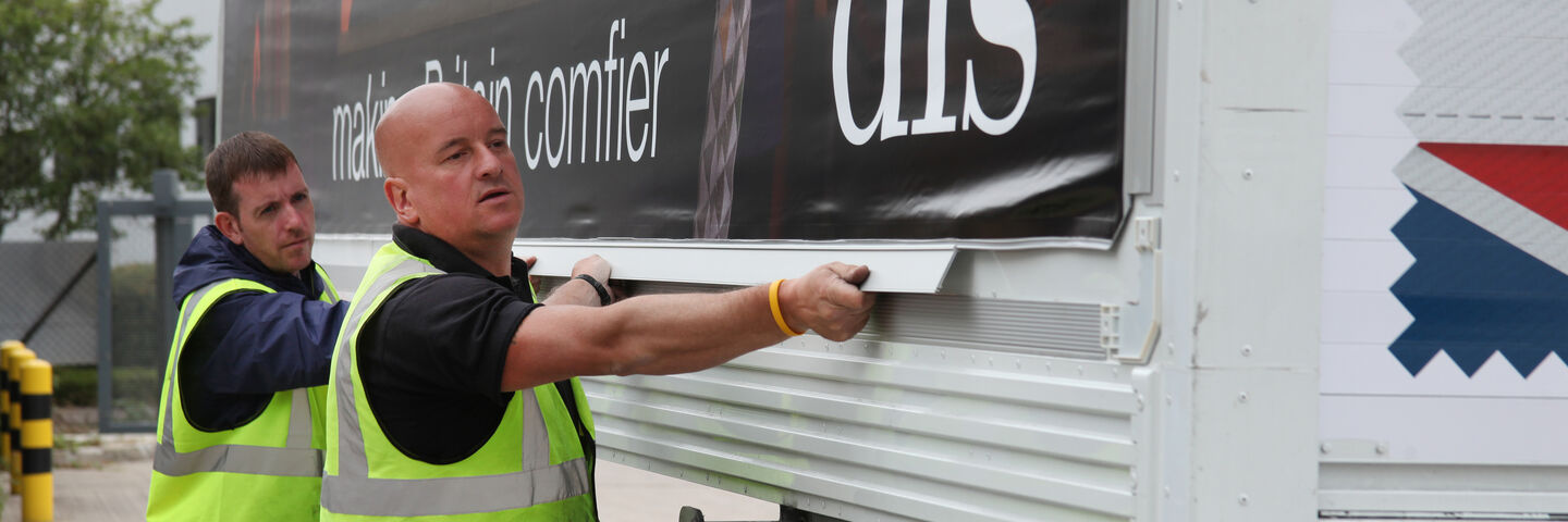 Installation of campaign banners in advertising frame system for DFS distribution fleet
