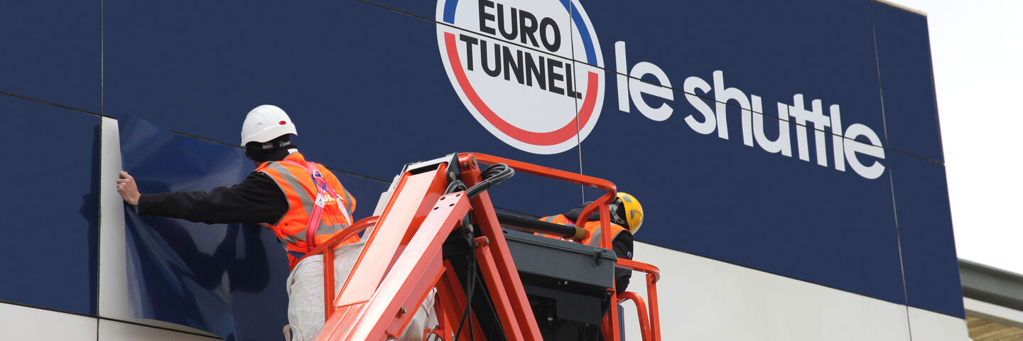 Installation of long-term branded building wrap to existing cladding for Eurotunnel