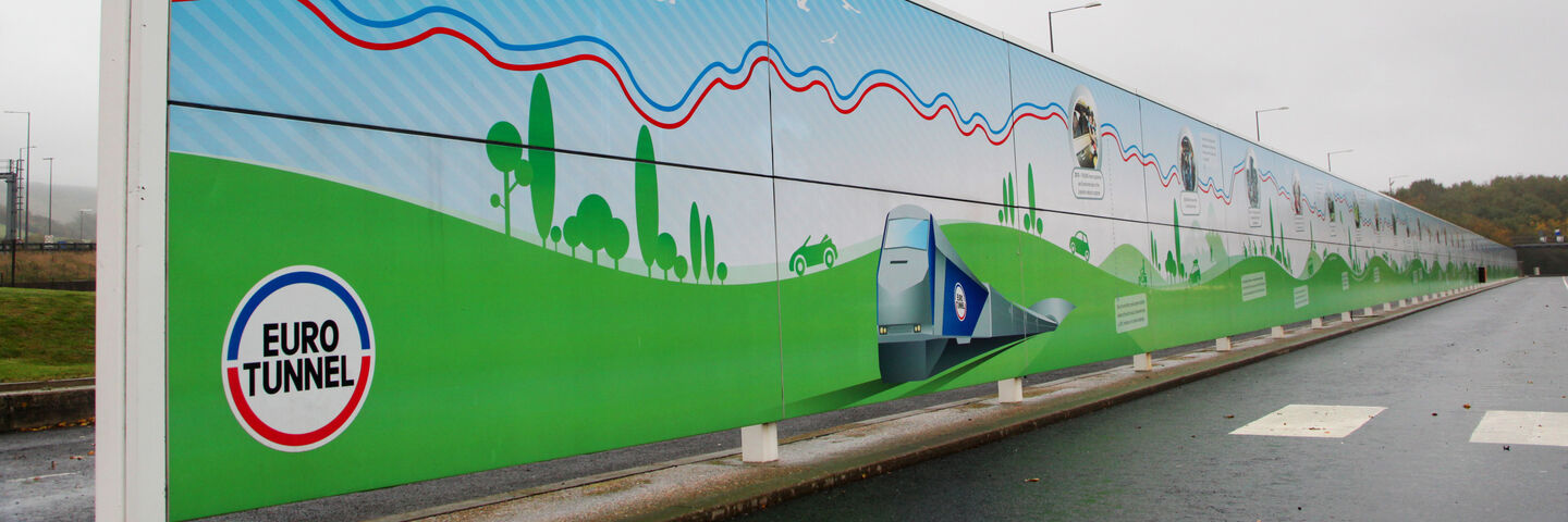 Large scale billboard wall displays promotional graphics for Euro Tunnel Le Shuttle
