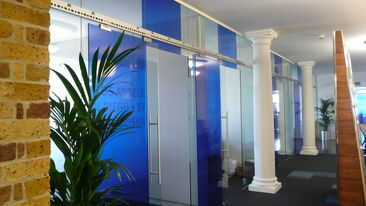 Translucent coloured window film used on office interior glazing