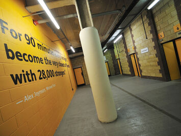 Printed graphics using special textured wall film for brick walls at Wolves FC stadium