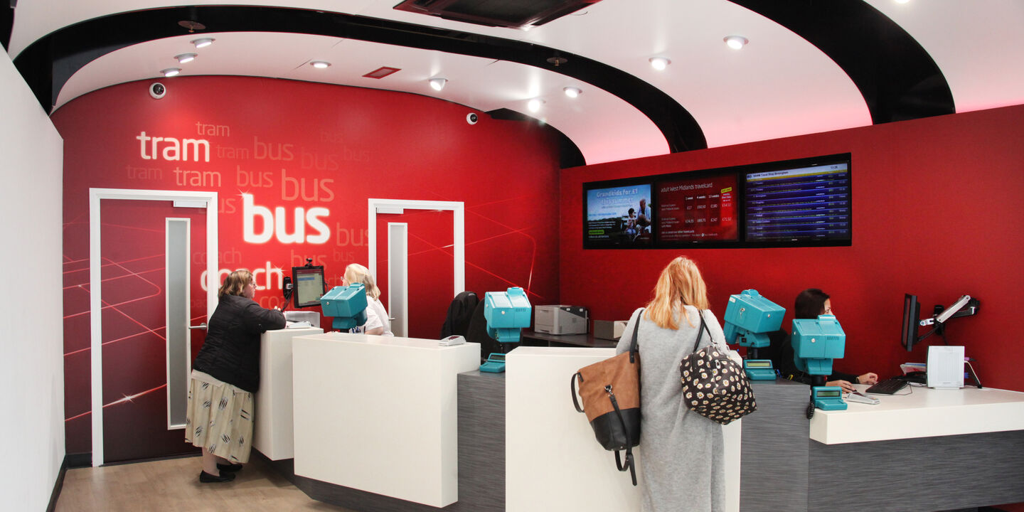 Travel West Midlands bus ticket office branding and wall graphics