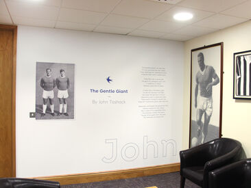 Printed wall graphics celebrating the club history in lounge area of Cardiff City FC