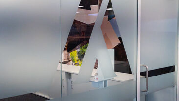 Glass manifestation frosted logo in Aura Brand Solutions offices